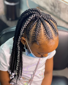 Beautiful braided protective style at M & Co.